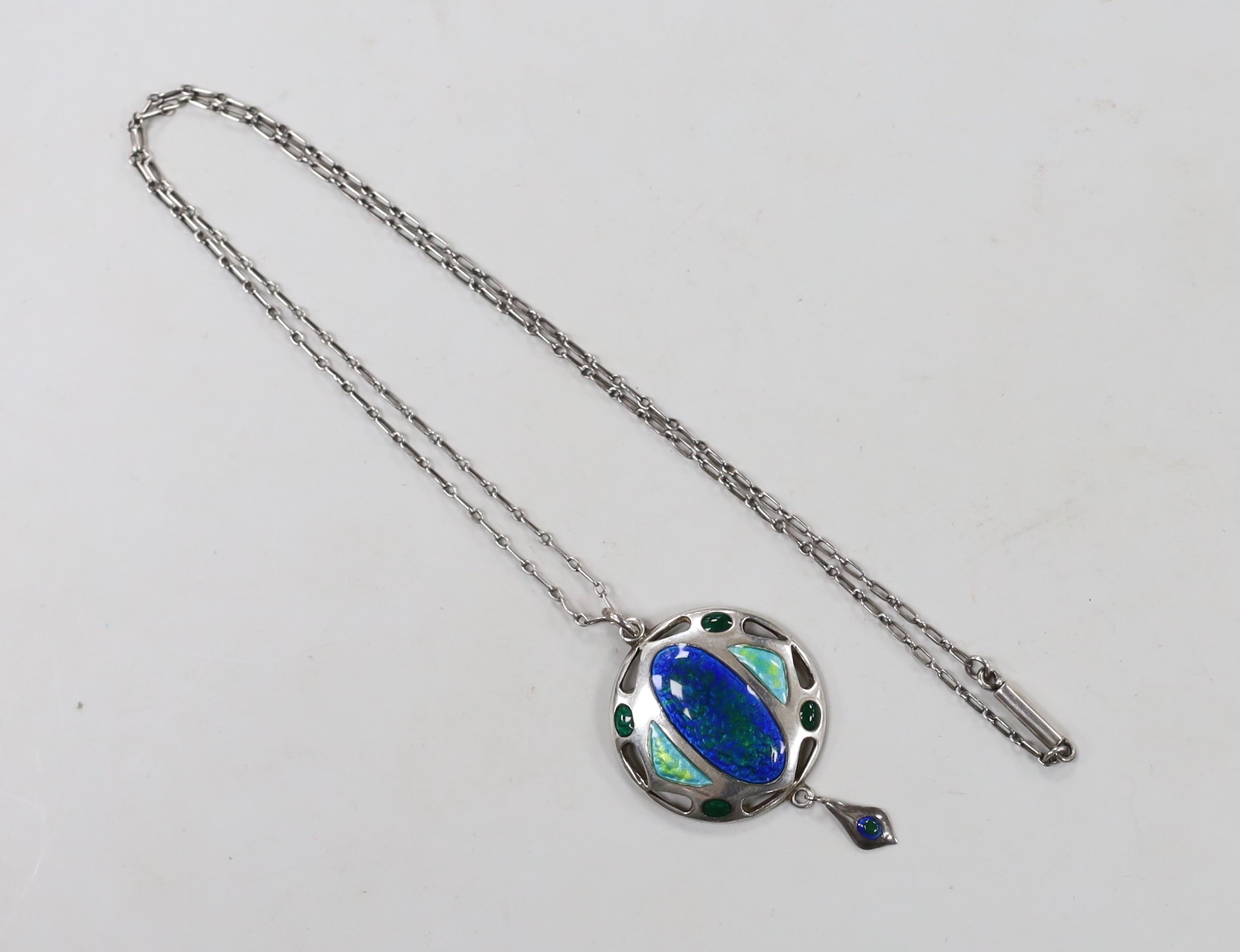 An Edwardian Art Nouveau silver and enamelled drop pendant, Smith & Ewen, Birmingham, 1909, 41mm, on a fine link chain, 42cm.